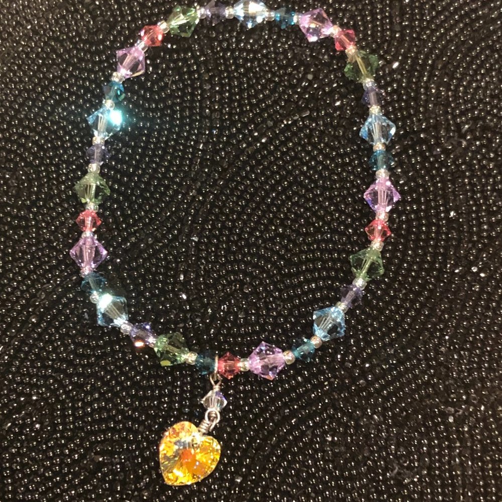Multi colored beaded bracelet with heart charm